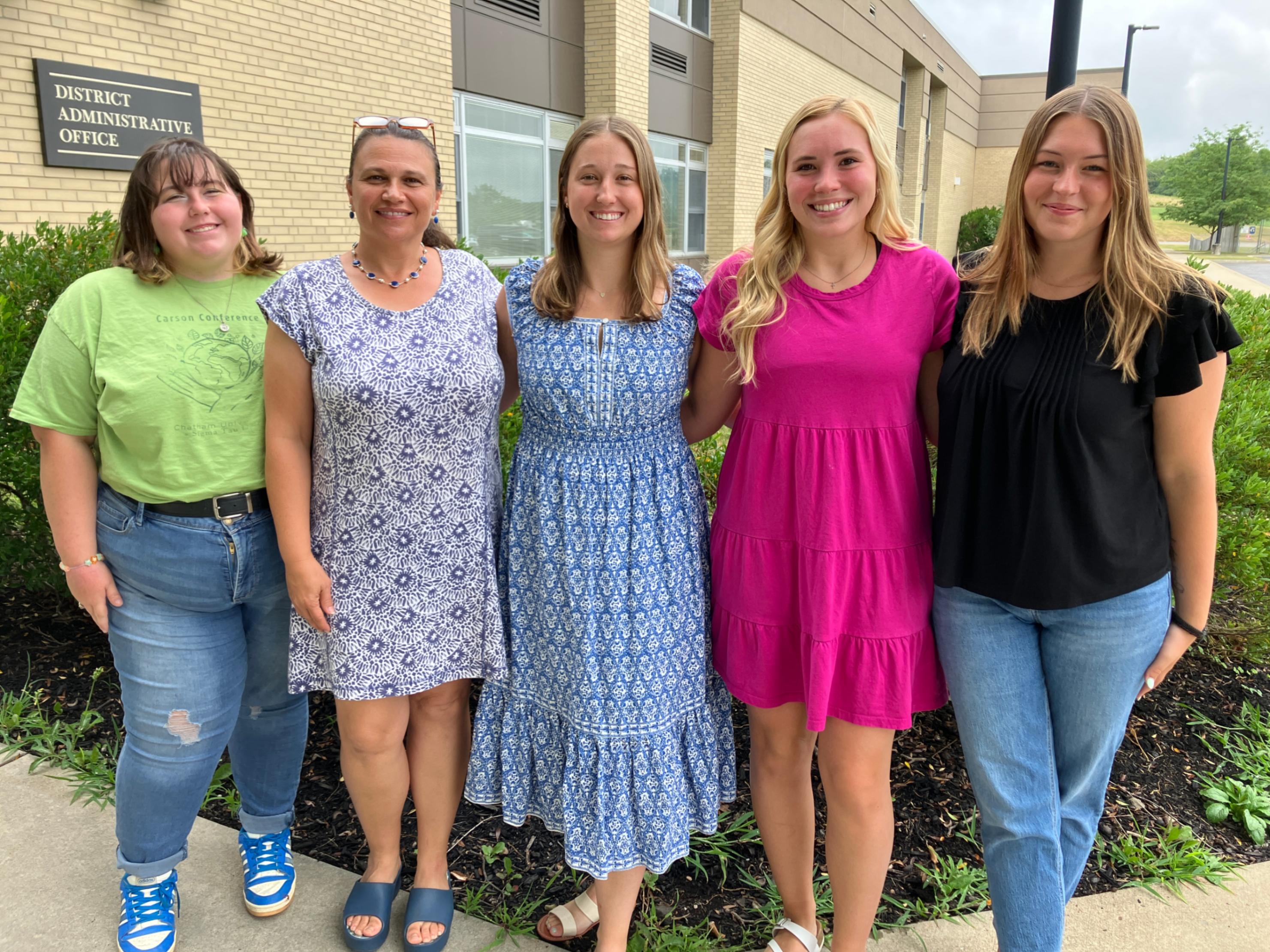 New faculty members pose for a photo on new teacher induction day.